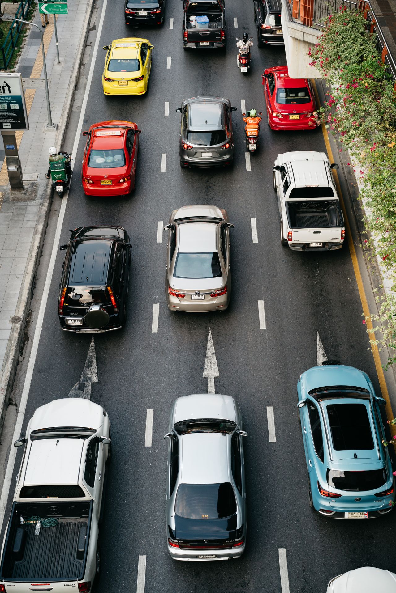 High-angle shot showcasing busy city traffic with various vehicles on an urban road